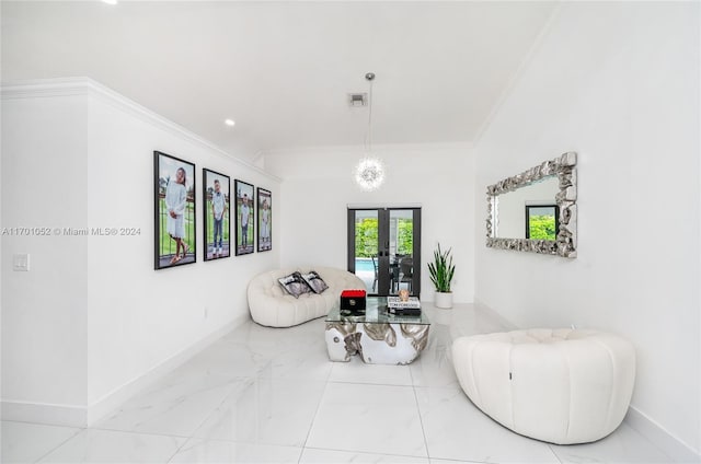 sitting room with french doors and crown molding