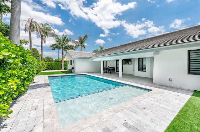 view of pool featuring a patio area