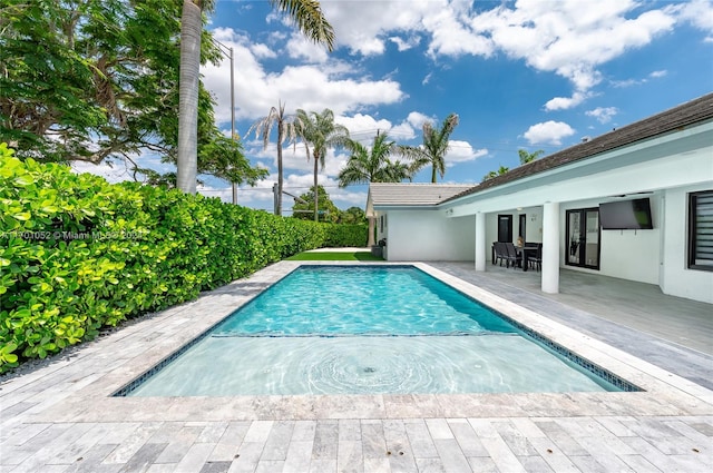 view of pool featuring a patio