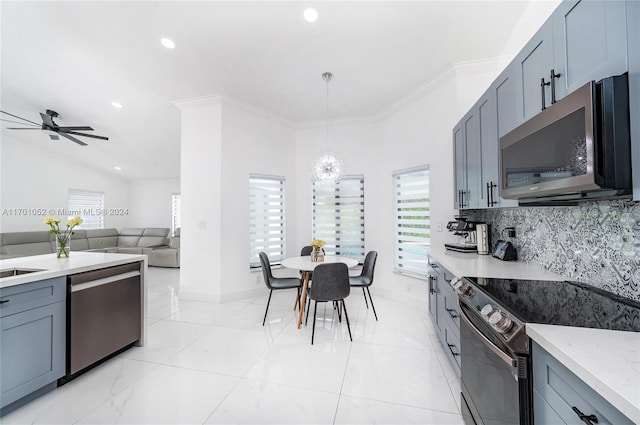 kitchen featuring decorative backsplash, ornamental molding, stainless steel appliances, sink, and pendant lighting