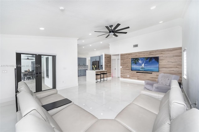 living room featuring ceiling fan, ornamental molding, and french doors