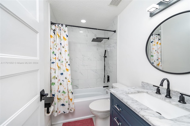 full bathroom featuring a textured ceiling, vanity, shower / tub combo, and toilet