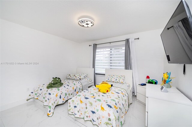 9701 SW 56th Ter, Miami, FL 33173 - bedroom with light marble finish floors