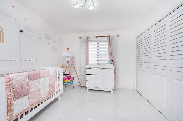 9701 SW 56th Ter, Miami, FL 33173 - bedroom featuring light marble finish flooring and baseboards