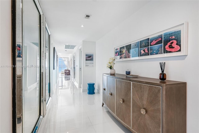 hallway with light tile patterned flooring