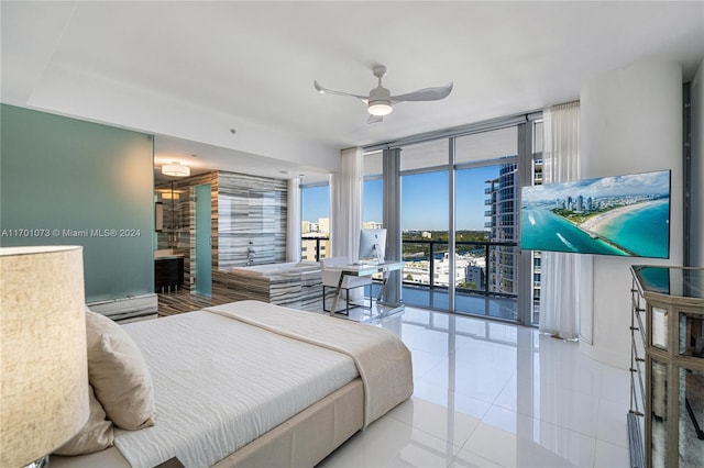 tiled bedroom featuring access to exterior, floor to ceiling windows, and ceiling fan