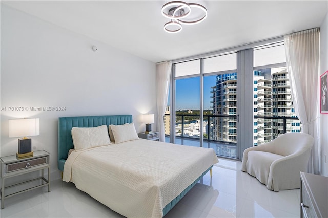 tiled bedroom featuring access to outside and floor to ceiling windows