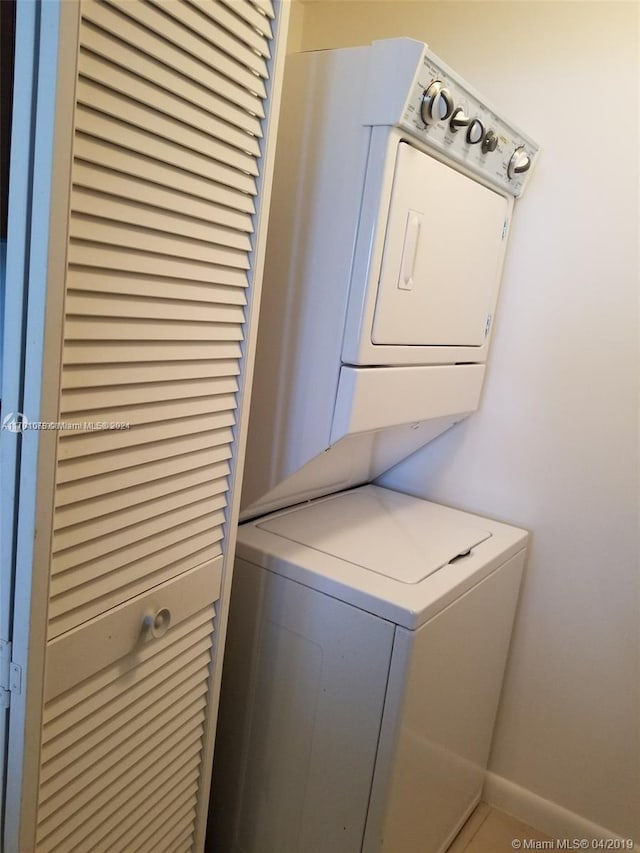 laundry area featuring stacked washer and dryer