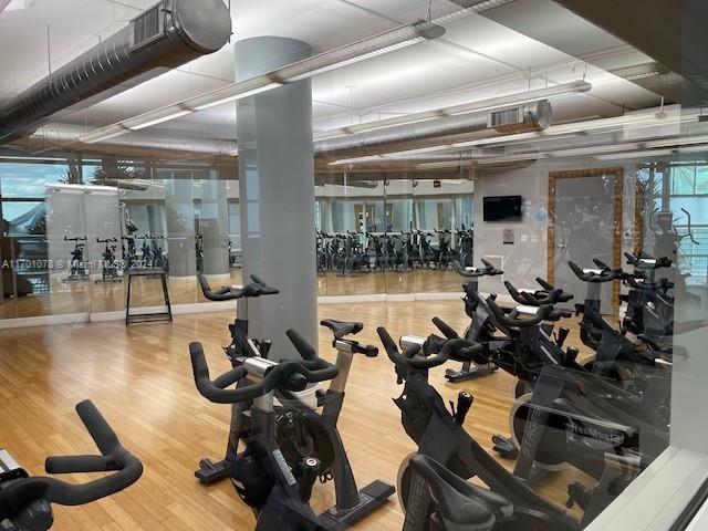 exercise room featuring hardwood / wood-style floors