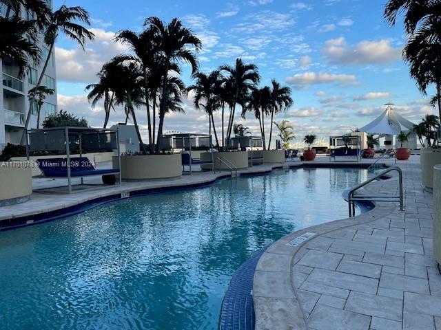 view of swimming pool with a patio