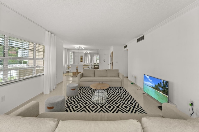 tiled living room featuring ornamental molding, a wealth of natural light, and a textured ceiling