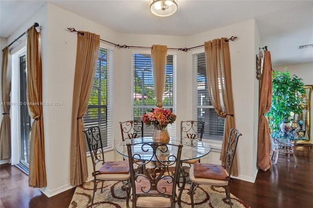 dining room featuring dark hardwood / wood-style floors and a wealth of natural light