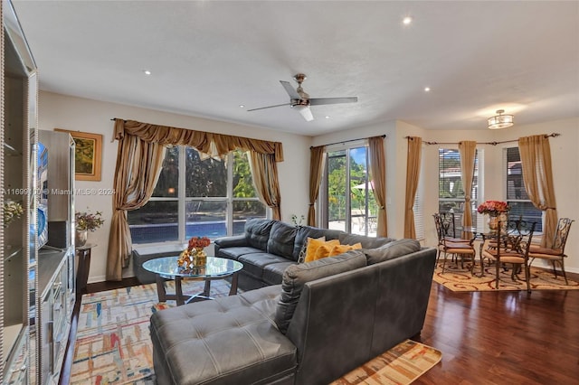 living room featuring hardwood / wood-style flooring and ceiling fan