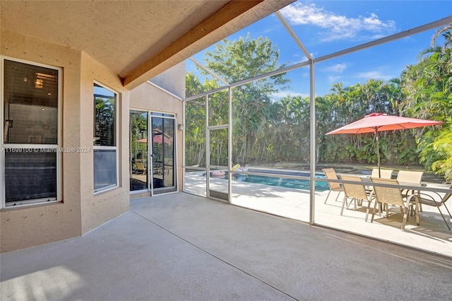 view of patio with a lanai