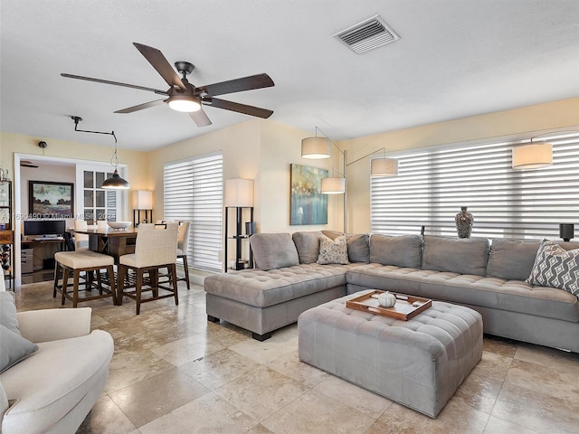 living room featuring ceiling fan