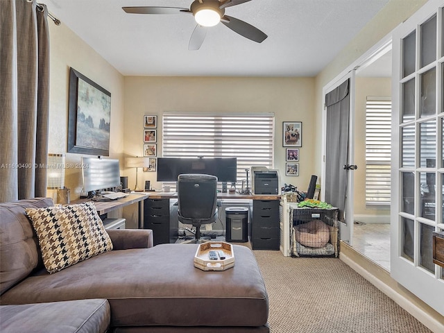 office space featuring ceiling fan, light carpet, a wealth of natural light, and french doors