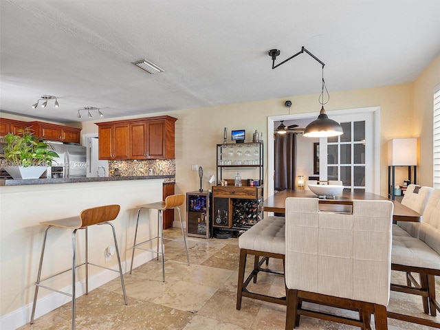 dining room with a textured ceiling