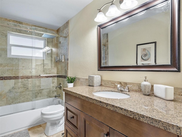 full bathroom featuring tile patterned flooring, vanity, toilet, and enclosed tub / shower combo