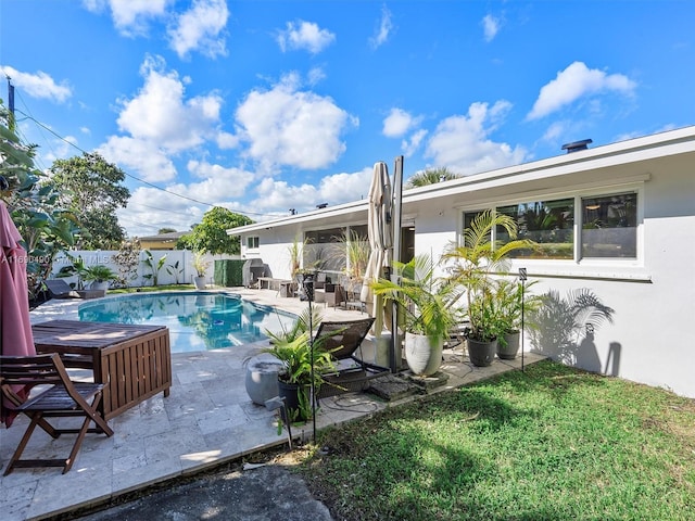 view of swimming pool with a patio