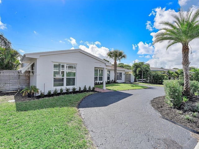 view of front of property with a front lawn