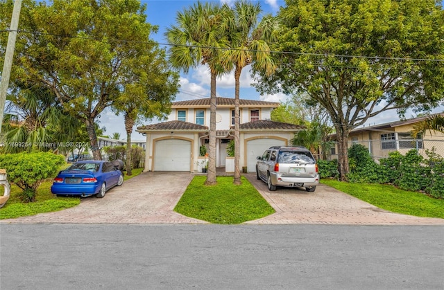 mediterranean / spanish-style home with a garage