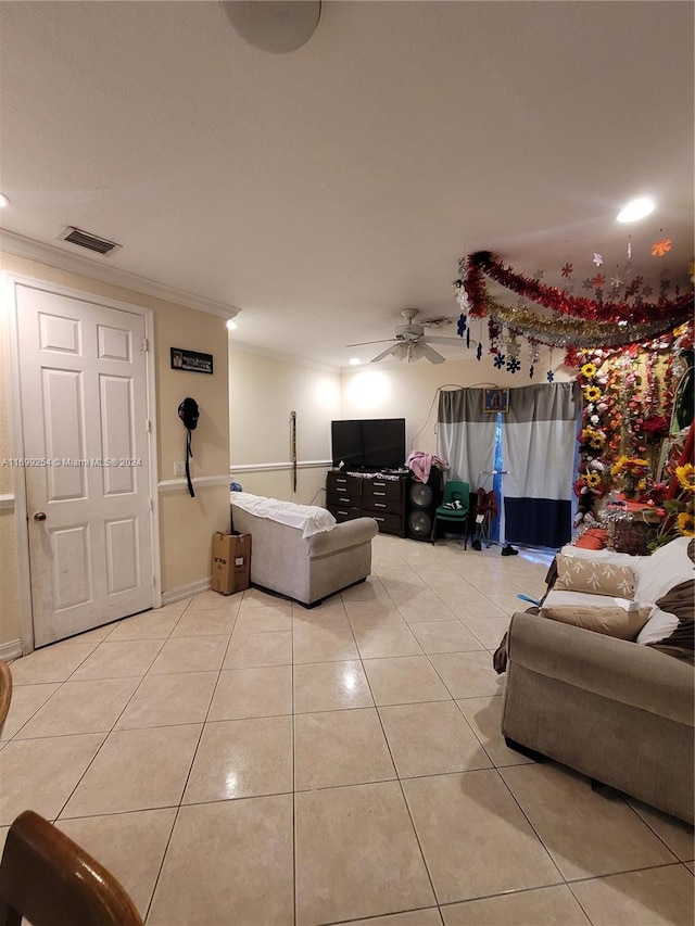 tiled living room featuring ceiling fan and ornamental molding