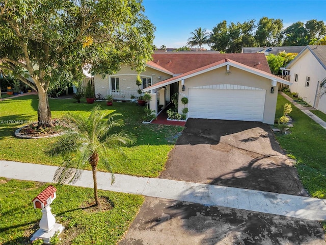 single story home with a garage and a front yard