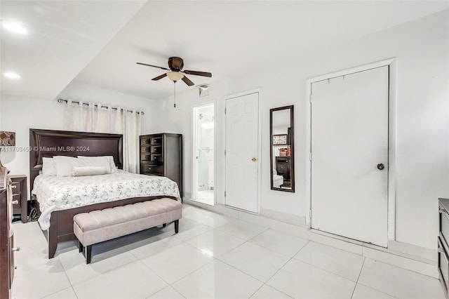 tiled bedroom with ceiling fan