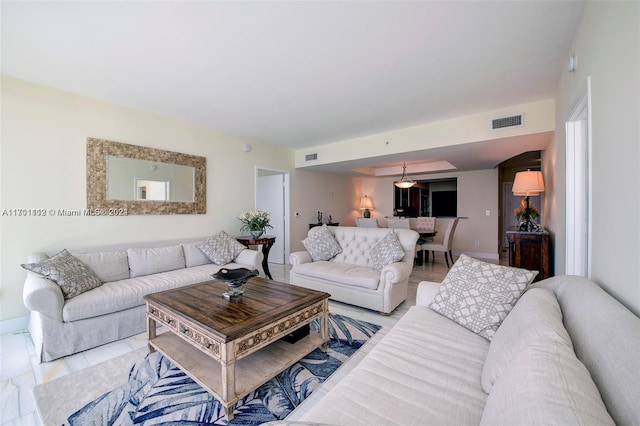 living room with light tile patterned floors