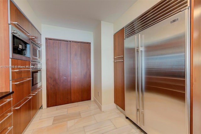 kitchen featuring built in appliances