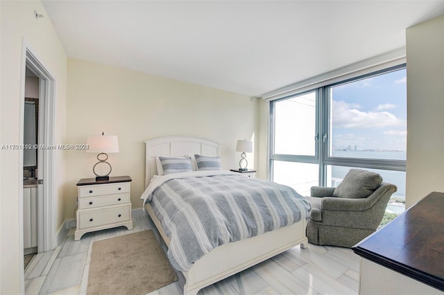 bedroom featuring multiple windows