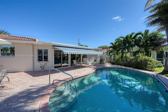 view of pool featuring a patio area