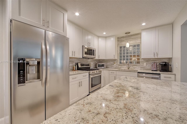 kitchen featuring white cabinetry and stainless steel appliances