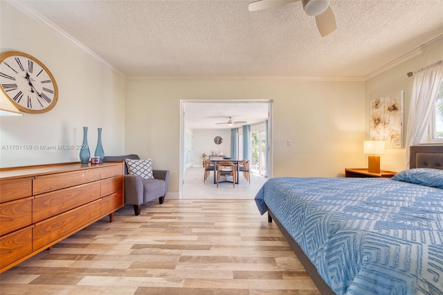 bedroom featuring a textured ceiling, light hardwood / wood-style floors, ceiling fan, and crown molding