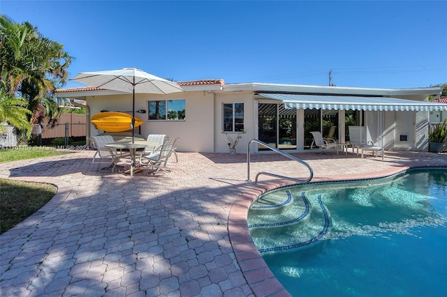 view of swimming pool with a patio area