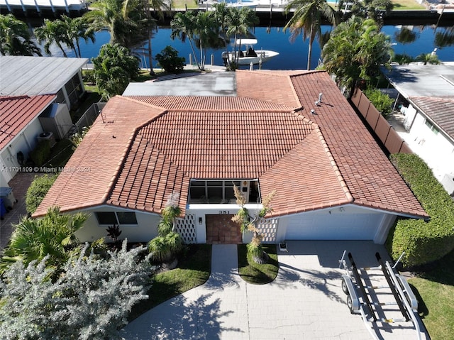 birds eye view of property featuring a water view