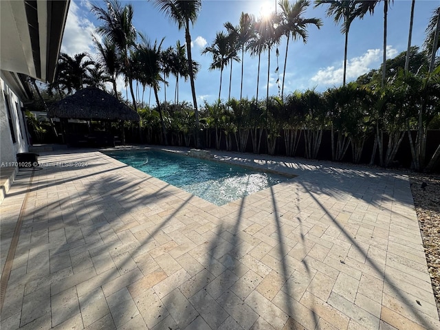 view of swimming pool featuring a gazebo and a patio area