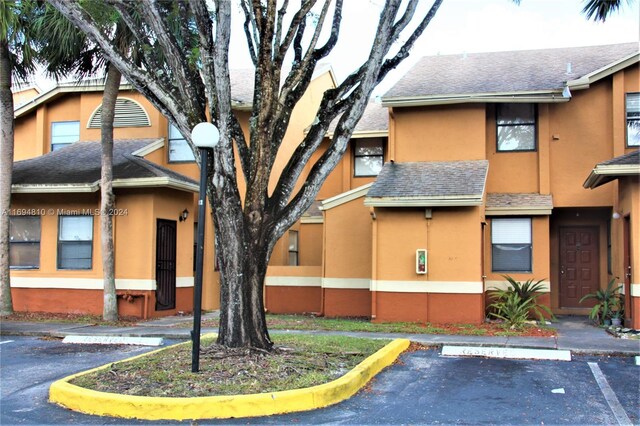 2531 NW 56th Ave Unit 109, Lauderhill, FL 33313 - view of building exterior featuring uncovered parking
