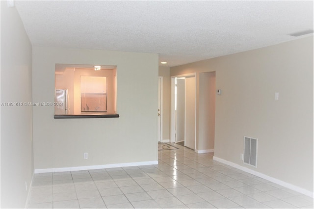 2531 NW 56th Ave Unit 109, Lauderhill, FL 33313 - spare room featuring light tile patterned floors, a textured ceiling, and recessed lighting