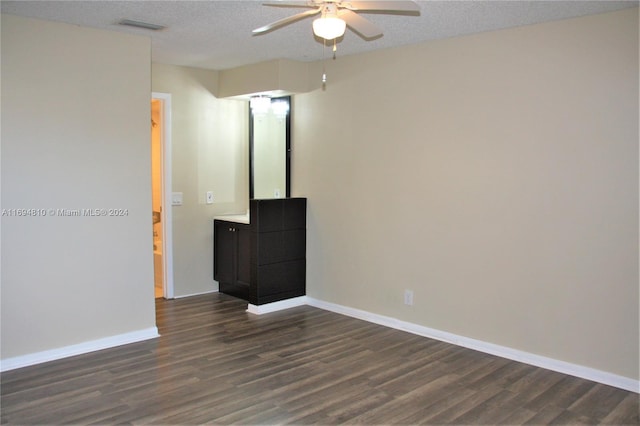 2531 NW 56th Ave Unit 109, Lauderhill, FL 33313 - spare room with a ceiling fan, dark wood-type flooring, and a textured ceiling