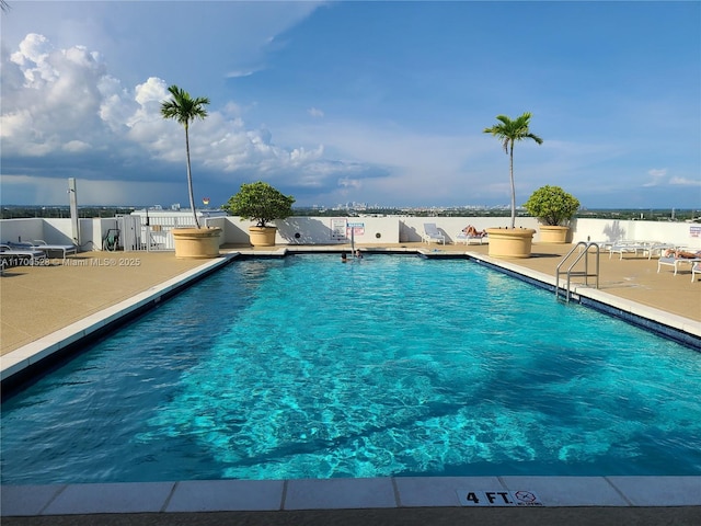 view of swimming pool featuring a patio area