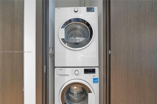 laundry area with stacked washer and dryer