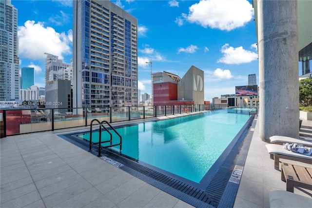 view of swimming pool with a patio area