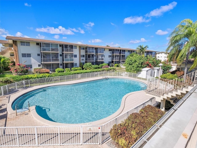 community pool featuring fence
