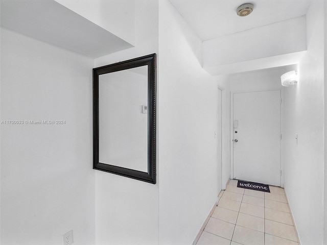 hallway with light tile patterned floors