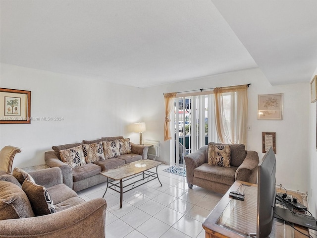 living room with light tile patterned floors