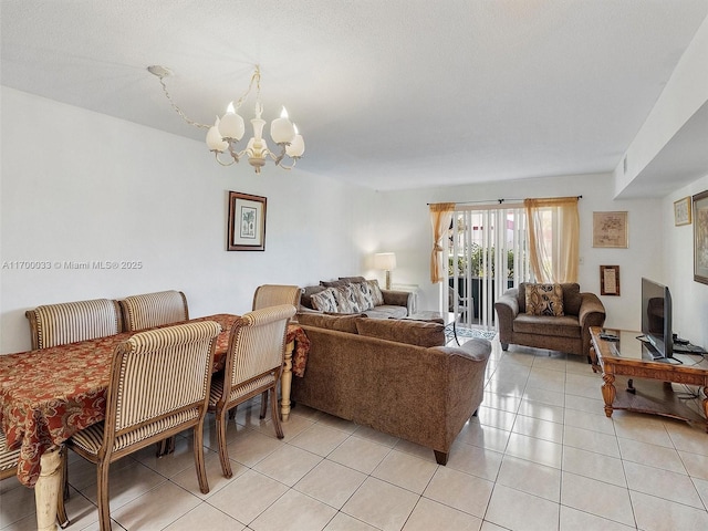 living room with an inviting chandelier and light tile patterned floors