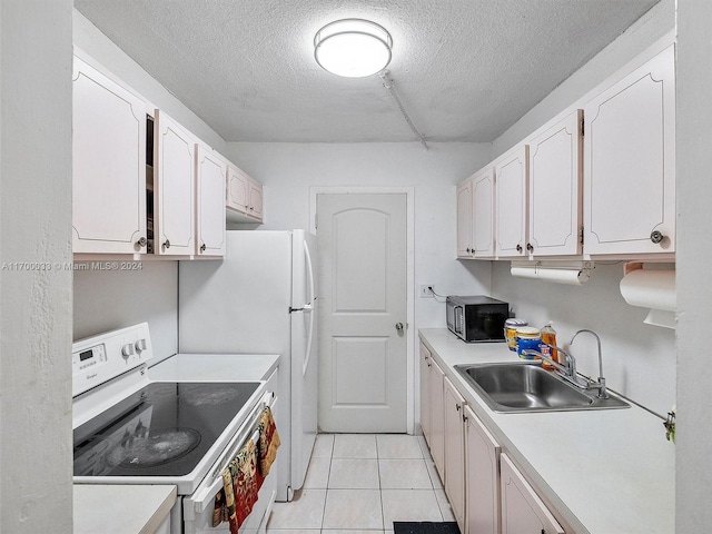 kitchen featuring a textured ceiling, white electric range oven, white cabinetry, and sink