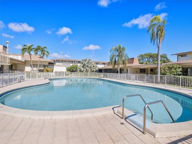 view of swimming pool with a patio area