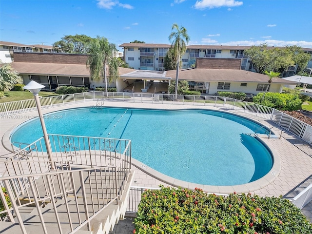 view of swimming pool with a patio